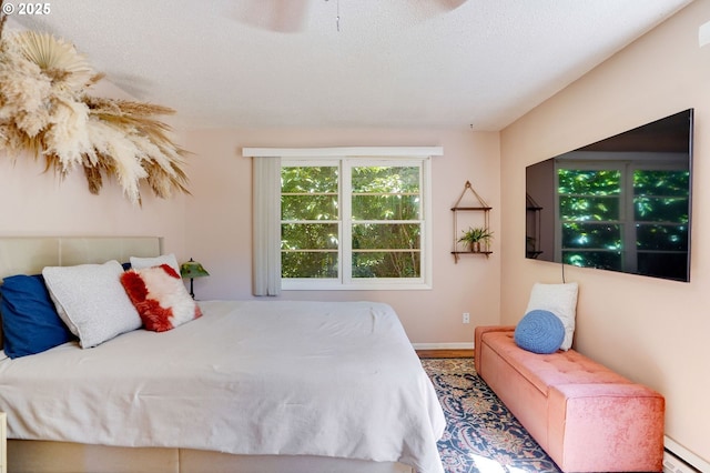 3374 Pioneer Dr, Salem, OR 97302 - bedroom featuring a baseboard heating unit and baseboards