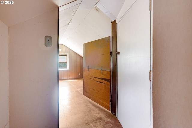 3374 Pioneer Dr, Salem, OR 97302 - hall featuring vaulted ceiling, wooden walls, and concrete floors
