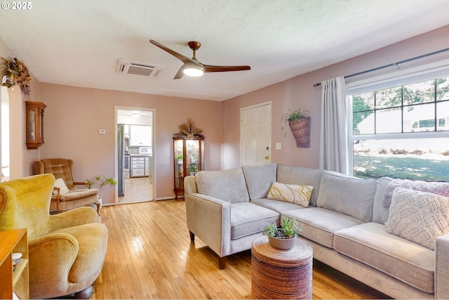 3374 Pioneer Dr, Salem, OR 97302 - living area featuring light wood finished floors and a ceiling fan