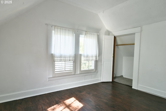 4820 SE Haig St, Portland, OR 97206 - unfurnished bedroom with vaulted ceiling, dark wood-type flooring, baseboards, and a closet
