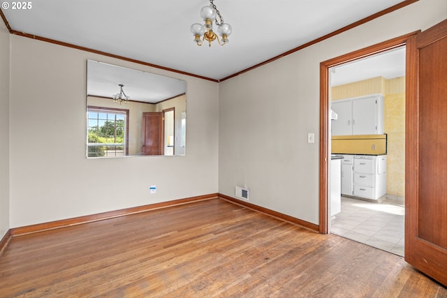 4715 N Willamette Blvd, Portland, OR 97203 - spare room featuring a chandelier, wood finished floors, and ornamental molding
