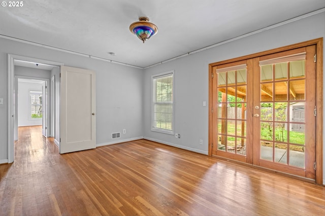 4715 N Willamette Blvd, Portland, OR 97203 - empty room with wood finished floors and french doors