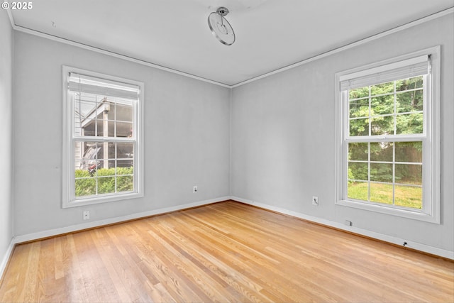 4715 N Willamette Blvd, Portland, OR 97203 - empty room featuring plenty of natural light, light wood finished floors, and ornamental molding