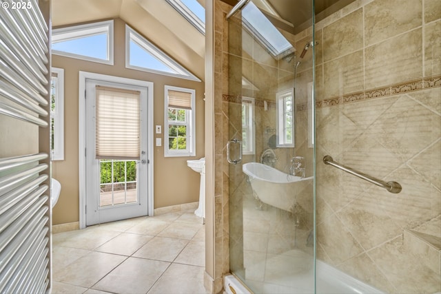 4715 N Willamette Blvd, Portland, OR 97203 - full bathroom featuring a towel warmer, a stall shower, tile patterned floors, vaulted ceiling, and a skylight