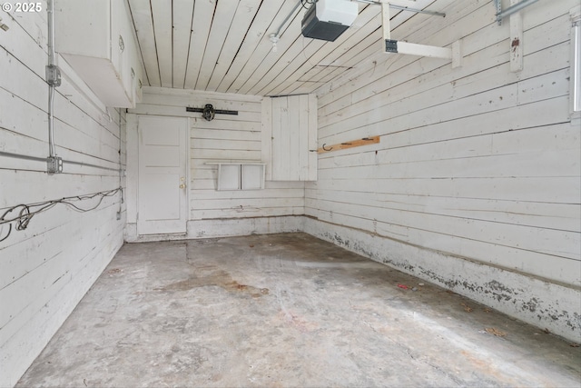 4715 N Willamette Blvd, Portland, OR 97203 - garage with a garage door opener and wood ceiling