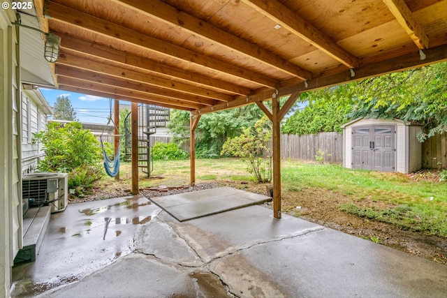 4715 N Willamette Blvd, Portland, OR 97203 - fenced backyard featuring a storage unit and a patio area