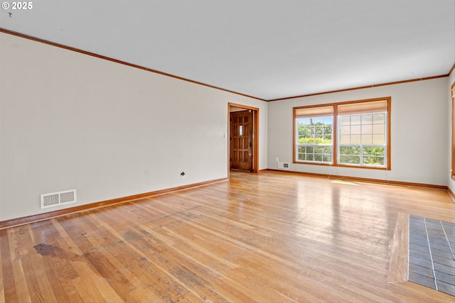 4715 N Willamette Blvd, Portland, OR 97203 - spare room featuring light wood-style flooring and ornamental molding