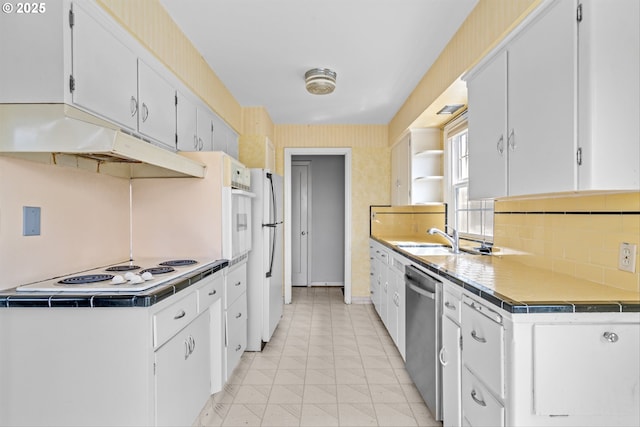 4715 N Willamette Blvd, Portland, OR 97203 - kitchen featuring white appliances, under cabinet range hood, and white cabinetry
