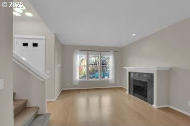 unfurnished living room featuring light hardwood / wood-style flooring