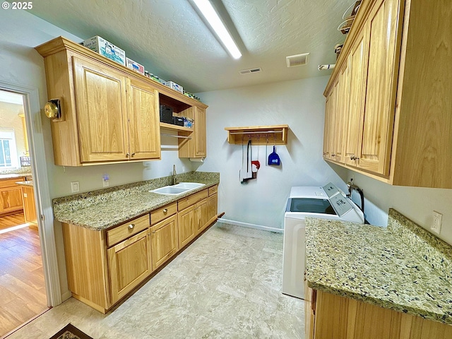 laundry room featuring cabinet space, separate washer and dryer, and baseboards