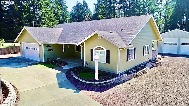 single story home with a shingled roof, fence, concrete driveway, and a garage