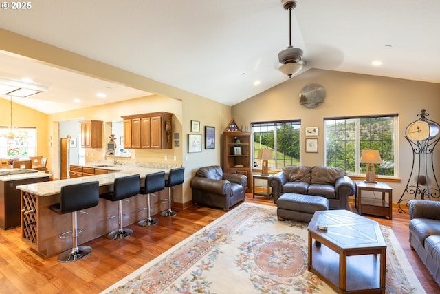 6065 Cherry Heights Rd, The Dalles, OR 97058 - living area with lofted ceiling, ceiling fan, light wood-style floors, a chandelier, and recessed lighting
