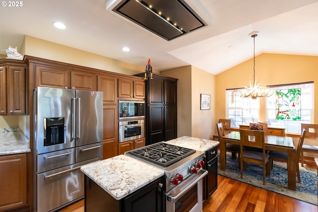 6065 Cherry Heights Rd, The Dalles, OR 97058 - kitchen featuring premium appliances, extractor fan, a chandelier, wood finished floors, and a center island
