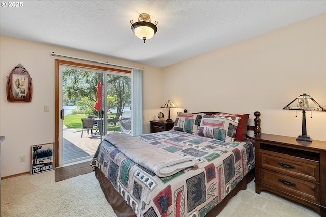 71848 Northshore Dr, Birkenfeld, OR 97016 - bedroom with access to outside, a textured ceiling, and light colored carpet