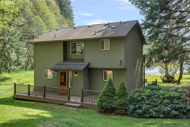71848 Northshore Dr, Birkenfeld, OR 97016 - back of property featuring a lawn, a shingled roof, and a deck
