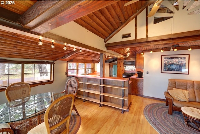 604 15th Ave, Seaside, OR 97138 - dining room featuring light wood-style flooring and wood ceiling