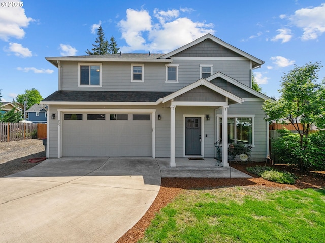 883 Washington St, Lafayette, OR 97127 - view of front of home featuring fence, an attached garage, concrete driveway, covered porch, and a shingled roof