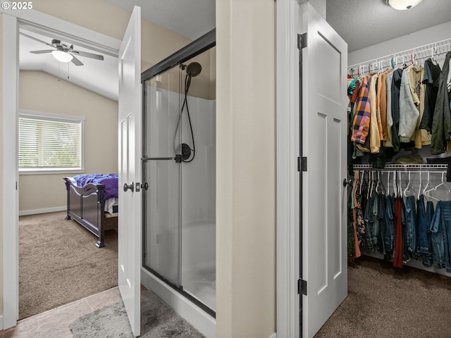 883 Washington St, Lafayette, OR 97127 - full bathroom featuring a ceiling fan, a spacious closet, a shower stall, lofted ceiling, and baseboards