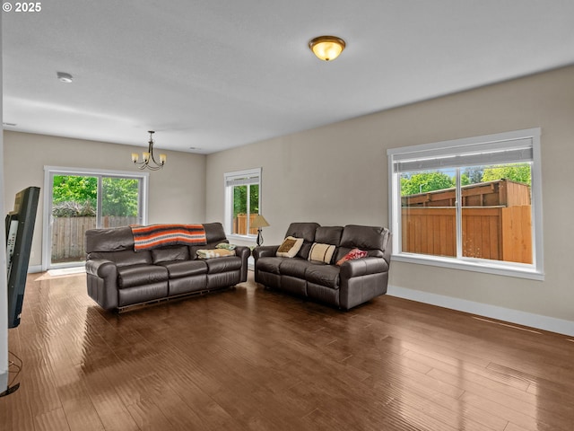 883 Washington St, Lafayette, OR 97127 - living area with a chandelier, healthy amount of natural light, dark wood-style flooring, and baseboards