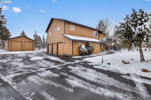 view of snow covered exterior featuring a deck