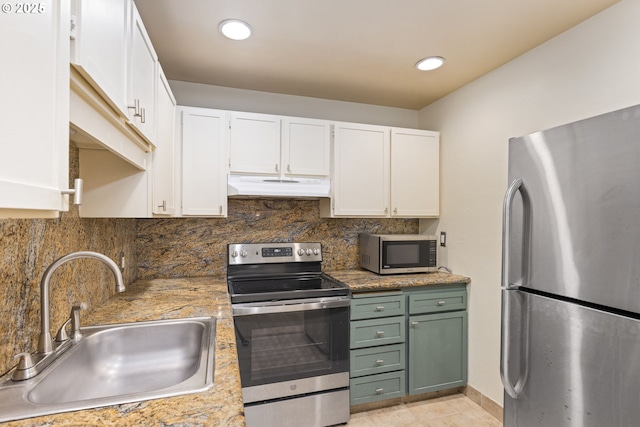 125 Oswego, Lake Oswego, OR 97035 - kitchen featuring appliances with stainless steel finishes, under cabinet range hood, a sink, white cabinets, and green cabinetry
