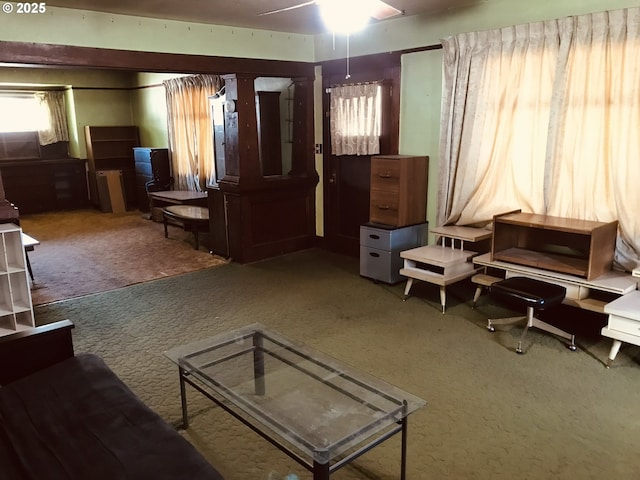 living room with carpet floors and ceiling fan
