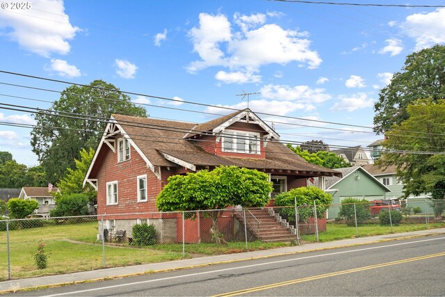 721 Columbia Blvd, Saint Helens, OR 97051 - view of front of property with a fenced front yard and a shingled roof