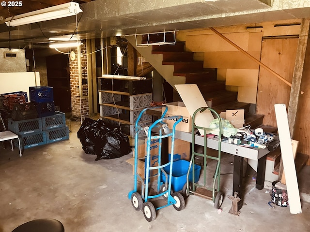 unfinished below grade area featuring stairway