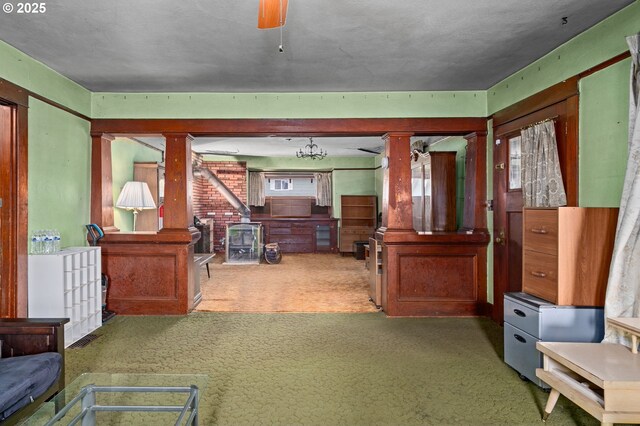 721 Columbia Blvd, Saint Helens, OR 97051 - carpeted living area with a wood stove