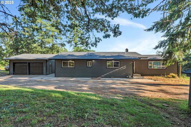 20700 SW Cherry Hill Rd, Sheridan, OR 97378 - back of house featuring an attached garage and driveway