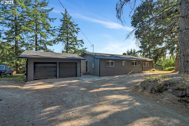 20700 SW Cherry Hill Rd, Sheridan, OR 97378 - view of home's exterior featuring a garage and a chimney