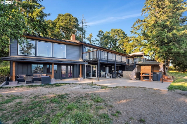 20700 SW Cherry Hill Rd, Sheridan, OR 97378 - back of house featuring a patio, an outdoor hangout area, a chimney, and a wooden deck