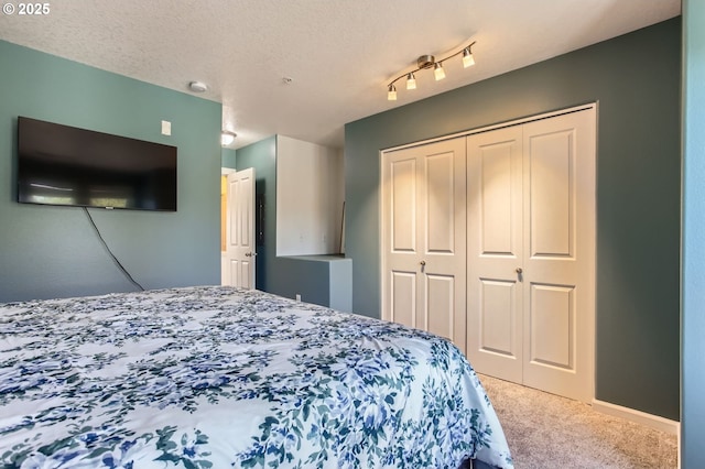 390 NW 116th Ave Unit 103, Portland, OR 97229 - bedroom featuring carpet flooring and a closet