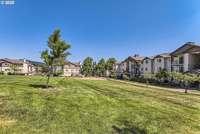 390 NW 116th Ave Unit 103, Portland, OR 97229 - view of grassy yard featuring a residential view