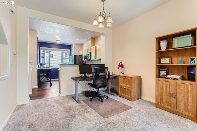 390 NW 116th Ave Unit 103, Portland, OR 97229 - office with light colored carpet and a chandelier