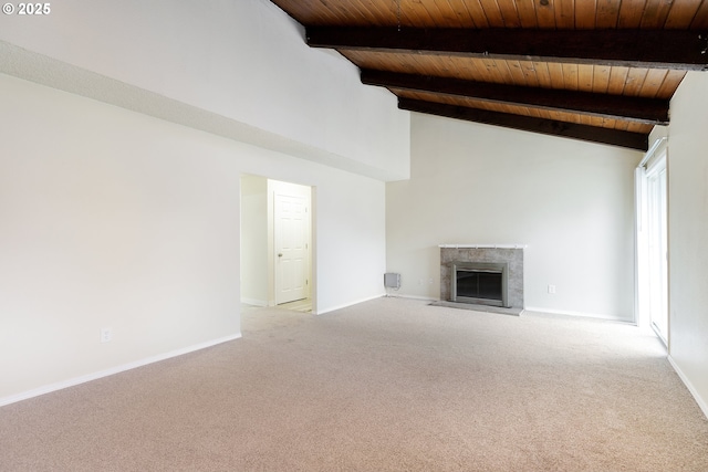 unfurnished living room featuring vaulted ceiling with beams, carpet flooring, a fireplace, and wood ceiling