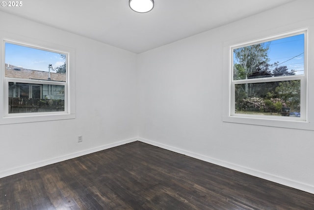 1489 Mckinley Ct, Eugene, OR 97402 - empty room featuring healthy amount of natural light and dark wood-style flooring