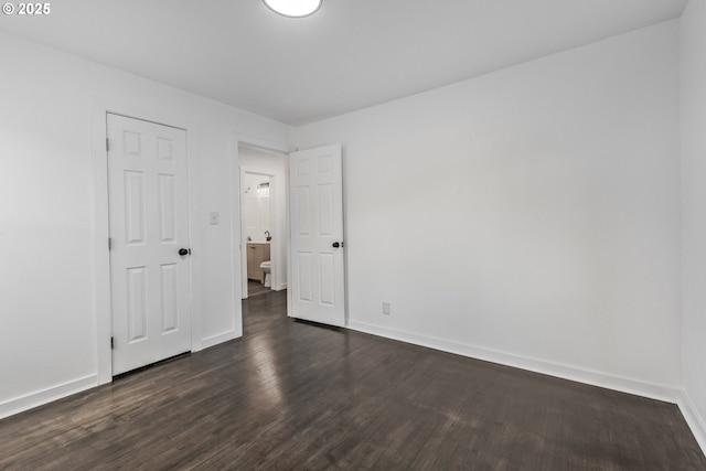 1489 Mckinley Ct, Eugene, OR 97402 - unfurnished bedroom featuring dark wood-style flooring