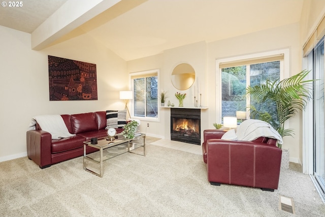 carpeted living room featuring vaulted ceiling