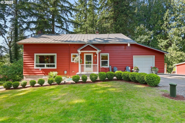 25701 S Morgan Rd, Estacada, OR 97023 - bungalow featuring a standing seam roof, a front lawn, a chimney, and asphalt driveway