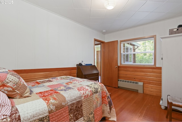 25701 S Morgan Rd, Estacada, OR 97023 - bedroom featuring radiator heating unit, wood finished floors, and crown molding