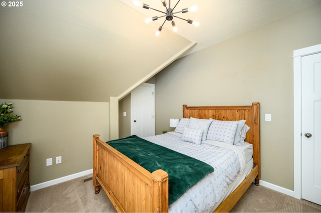 bedroom featuring light carpet, lofted ceiling, and baseboards