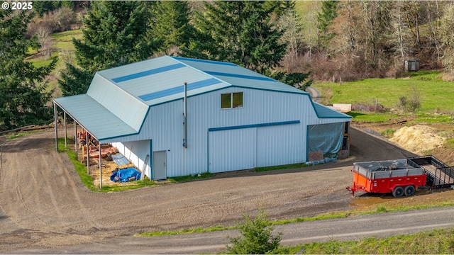 view of pole building featuring driveway