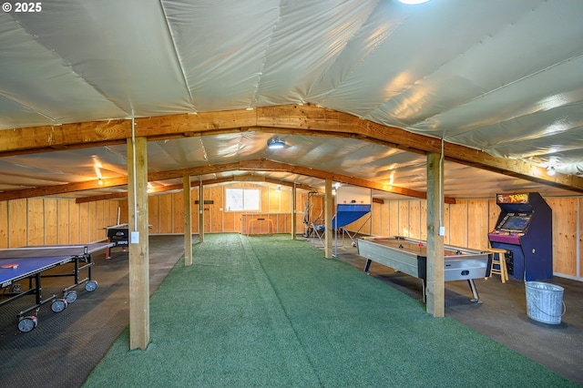 interior space with carpet flooring and wooden walls