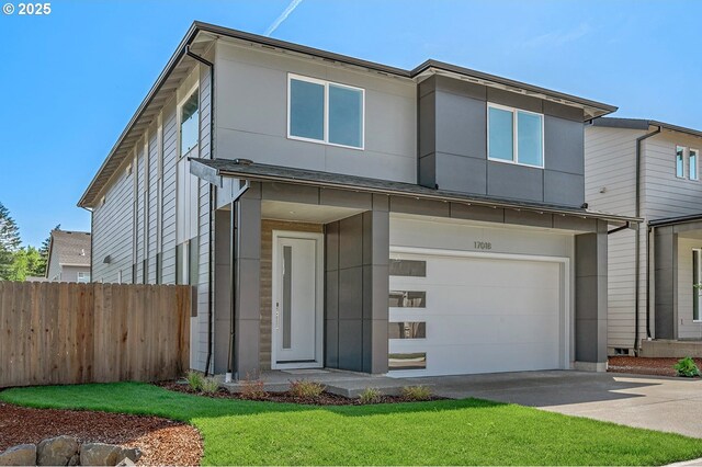 view of front facade featuring fence, a front lawn, a garage, stucco siding, and driveway