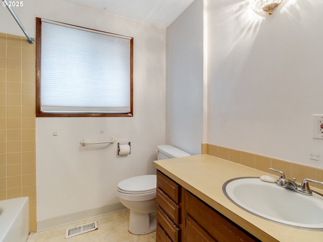 full bathroom featuring tile patterned flooring, toilet, vanity, visible vents, and tub / shower combination