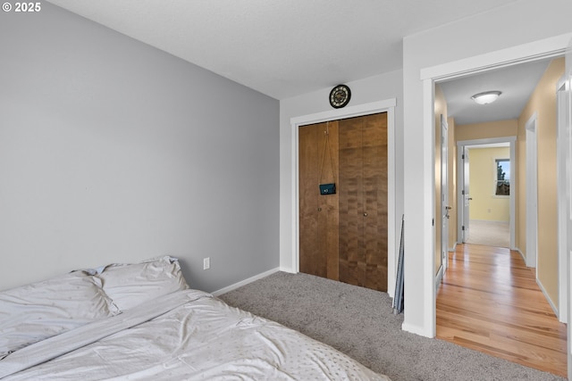 611 Summit Ridge Dr, The Dalles, OR 97058 - bedroom featuring light colored carpet, a closet, and baseboards