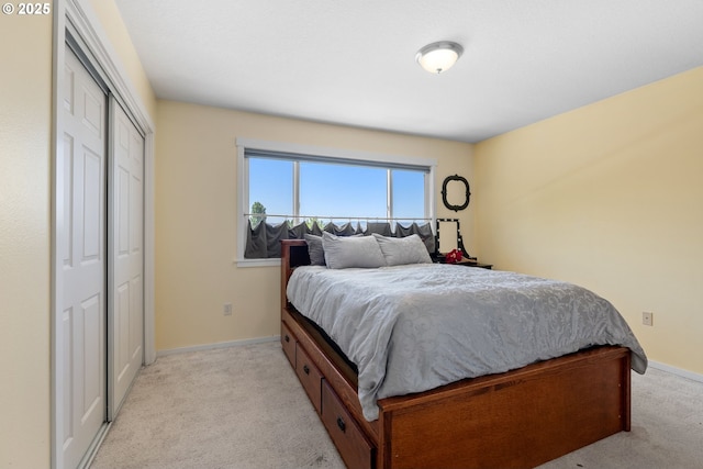 611 Summit Ridge Dr, The Dalles, OR 97058 - bedroom featuring light carpet, baseboards, and a closet