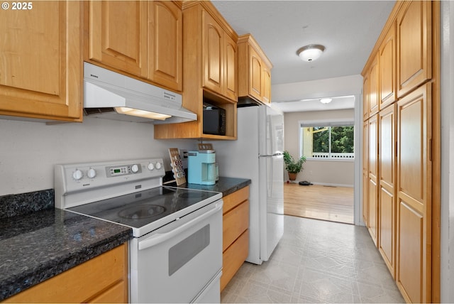 611 Summit Ridge Dr, The Dalles, OR 97058 - kitchen featuring white appliances, under cabinet range hood, and light flooring