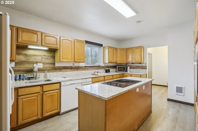 4314 SE 72nd Ave, Portland, OR 97206 - kitchen featuring white appliances, a sink, a center island, heating unit, and light wood-type flooring